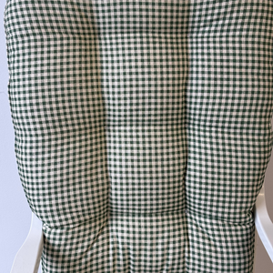 close up of fir green gingham fabric glider rocker replacement cushions on a glider rocking chair