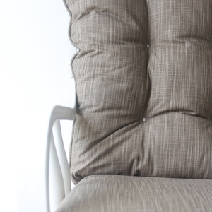 closeup of glider rocker replacement cushions in solid brown fabric