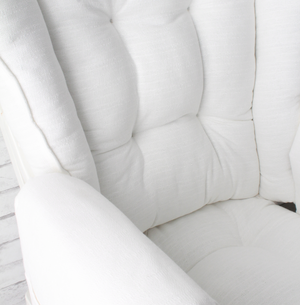 closeup of white wingback glider replacement cushions with optional arm rest covers