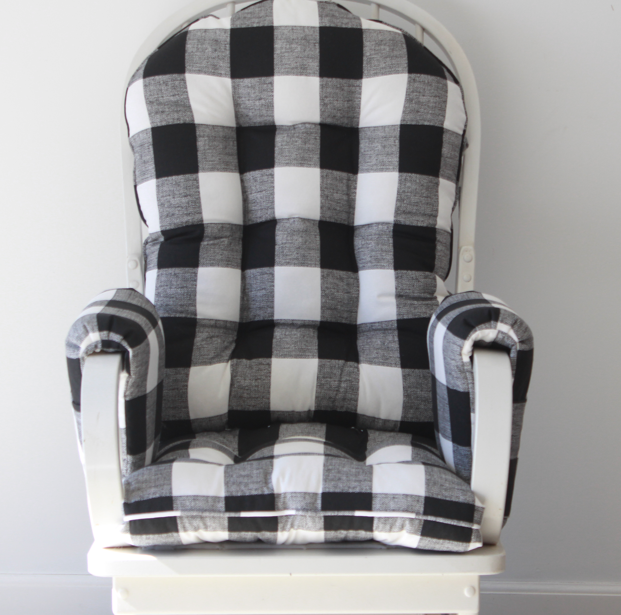 Glider replacement cushions with arm rest covers in black and white buffalo plaid
