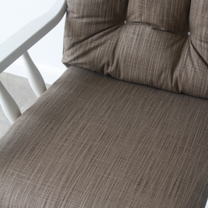 closeup of glider rocker replacement foam seat cushion in solid brown fabric