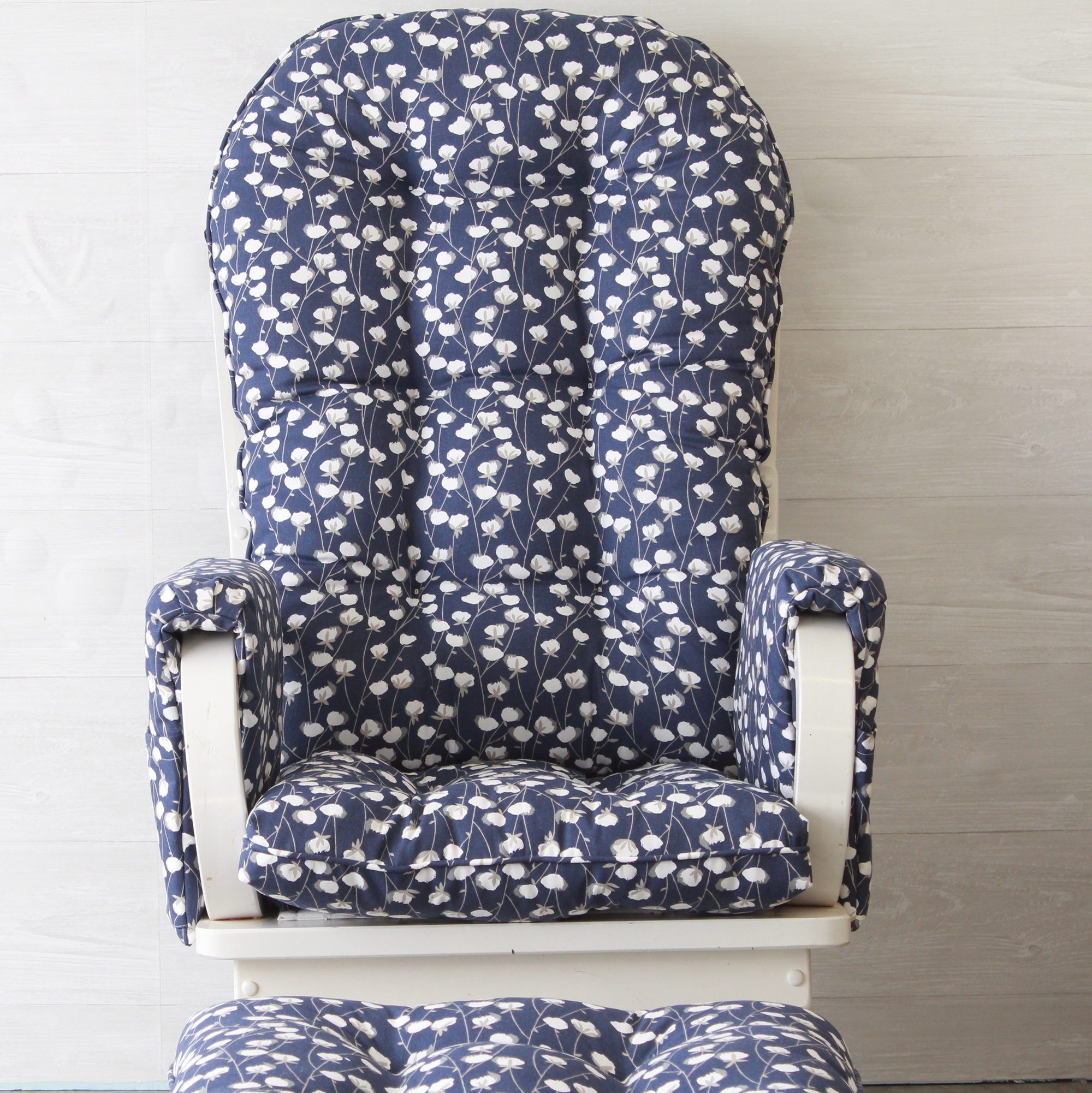 replacement cushions for a nursery glider or rocker with arm rest covers and ottoman cushion in navy upholstery fabric with white cotton bolls