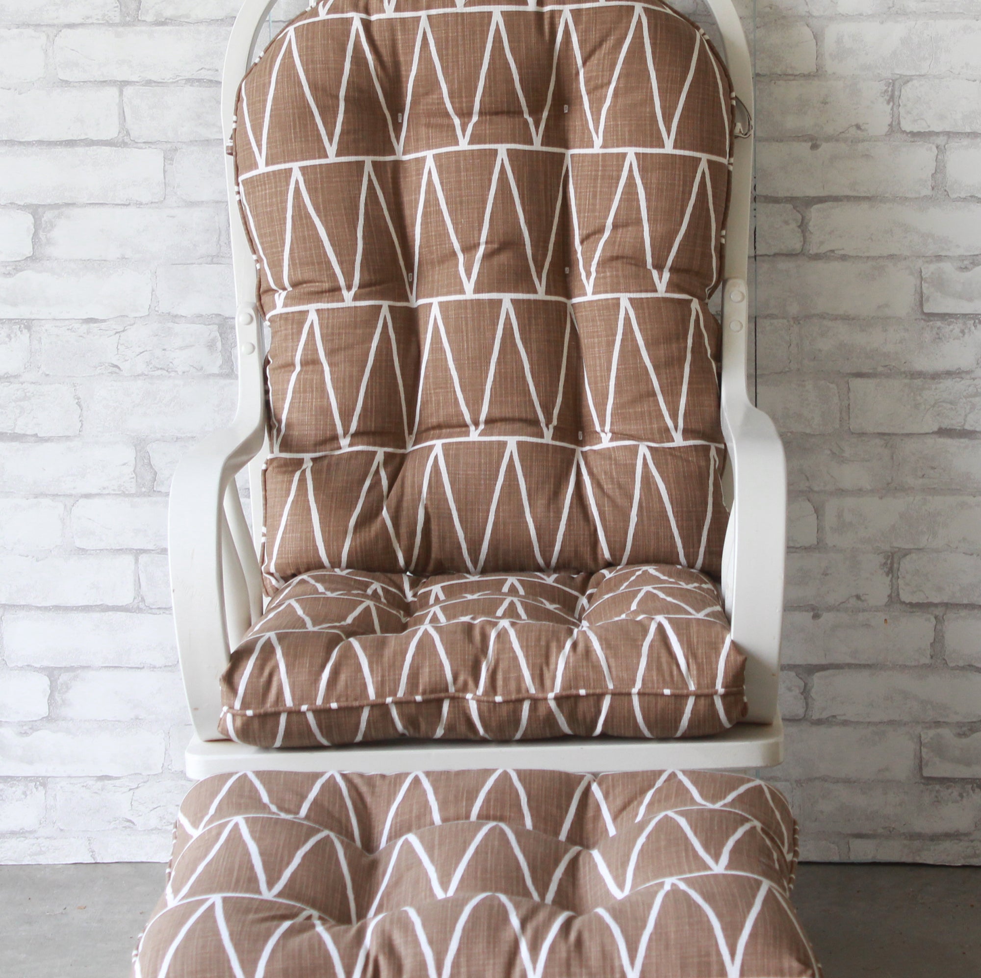 glider rocker cushions and ottoman cushion in brown fabric with white triangles
