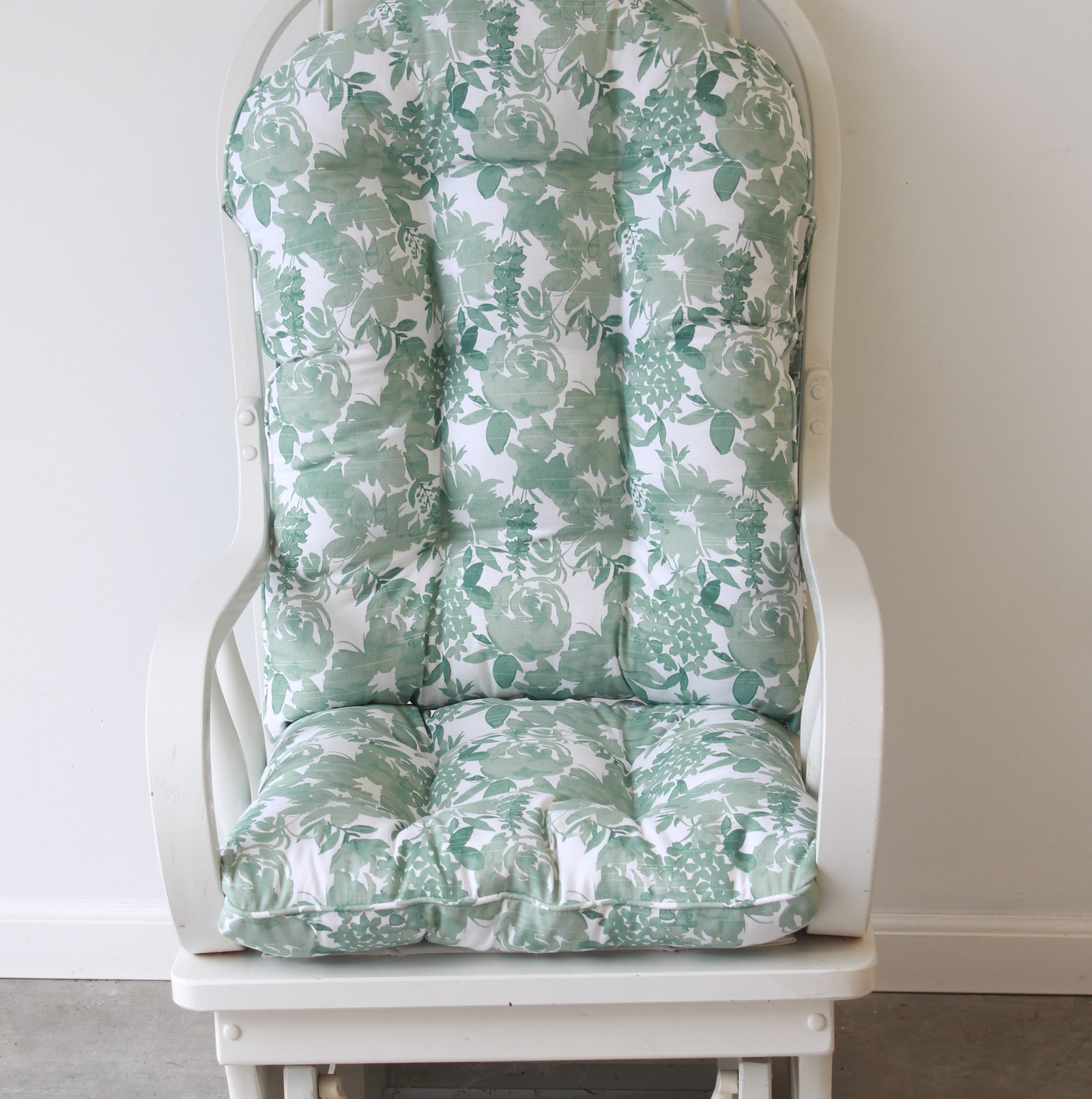 tufted glider replacement cushions in green floral fabric