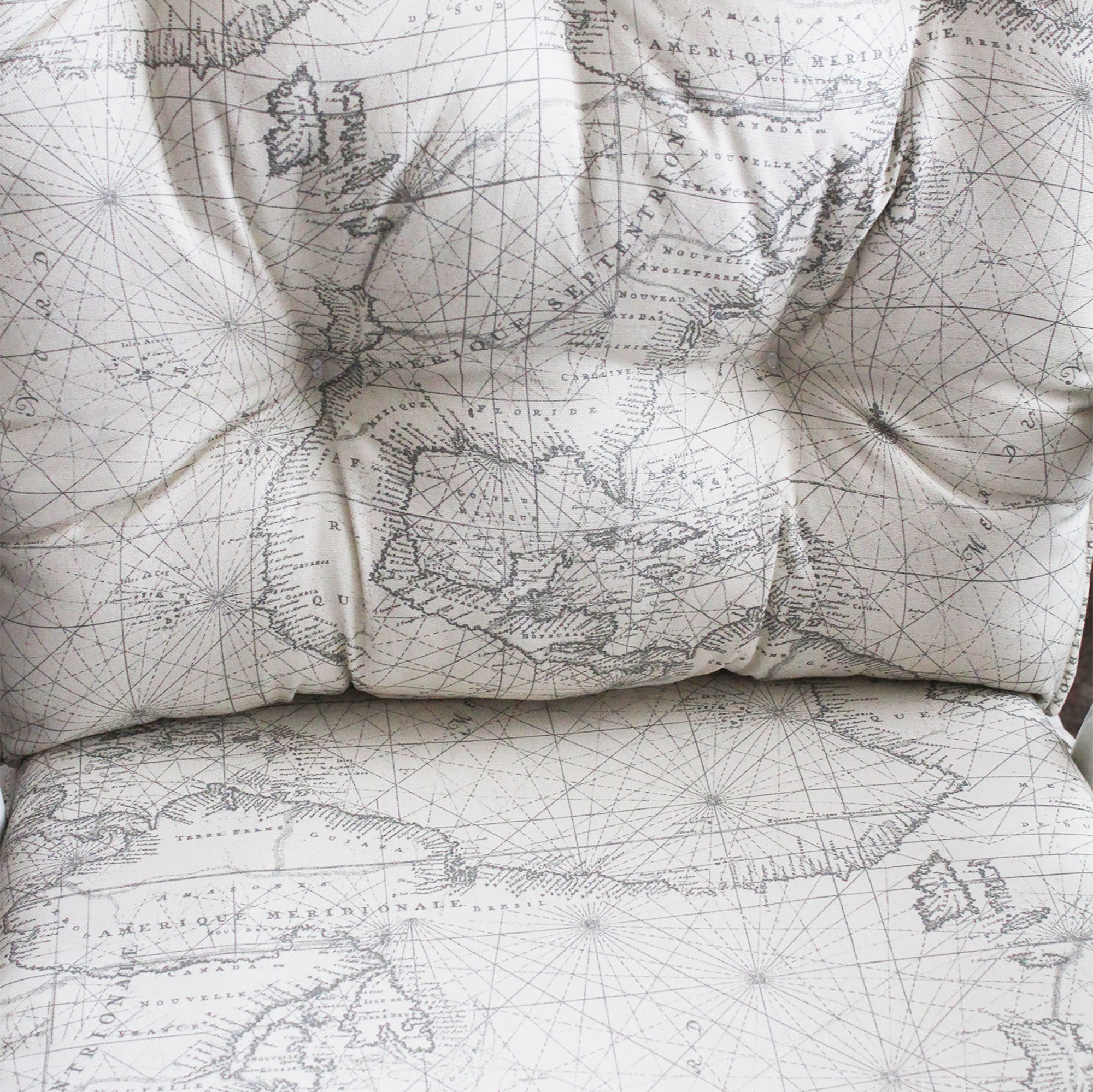 upholstery fabric with map print on a beige background used for glider replacement cushions with a foam seat