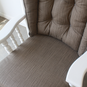 closeup of glider rocker replacement cushions in solid brown fabric