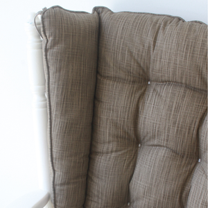 closeup of wingback glider rocker replacement cushions in solid brown fabric